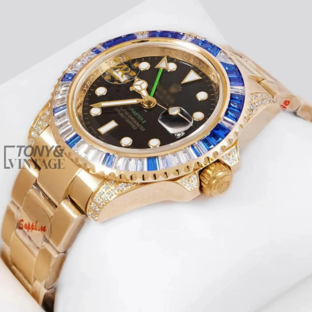 GMT-40-Yellow-Gold-Black-Dial-Blue-Stone-Bezel1.webp