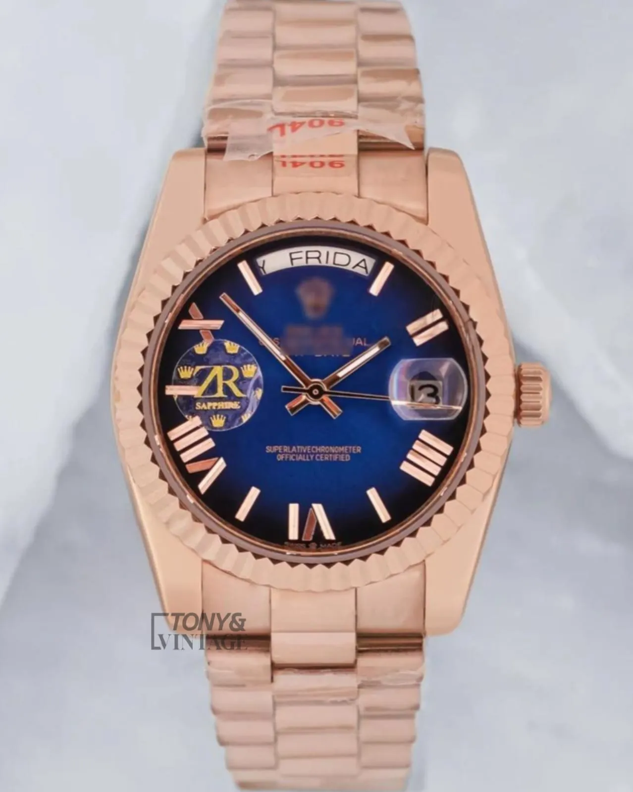 Rose-Gold-Blue-Dial-Fluted-Bezel1.webp