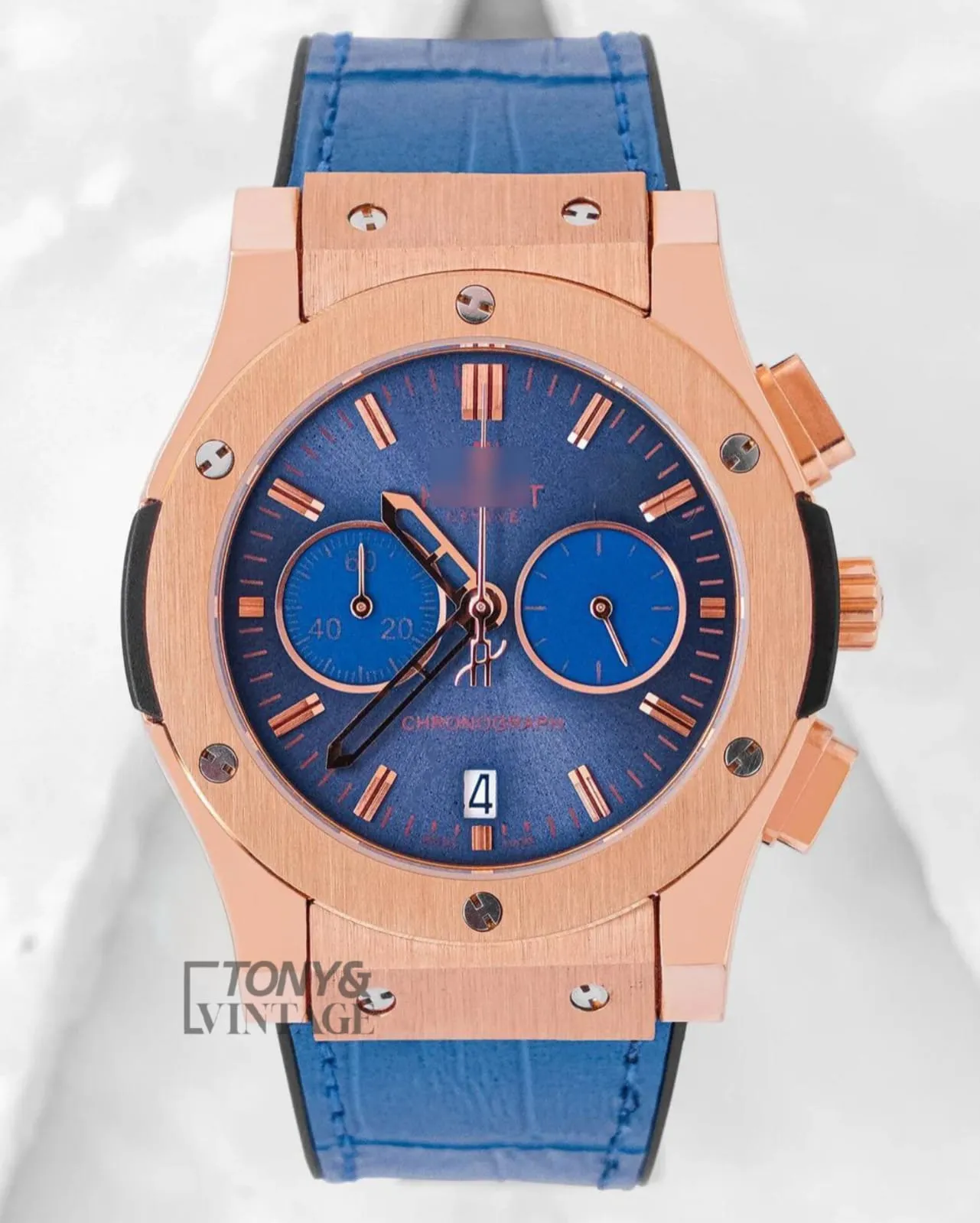 Rose-Gold-Chronograph-With-Blue-Dial-and-Leather-Strap.webp