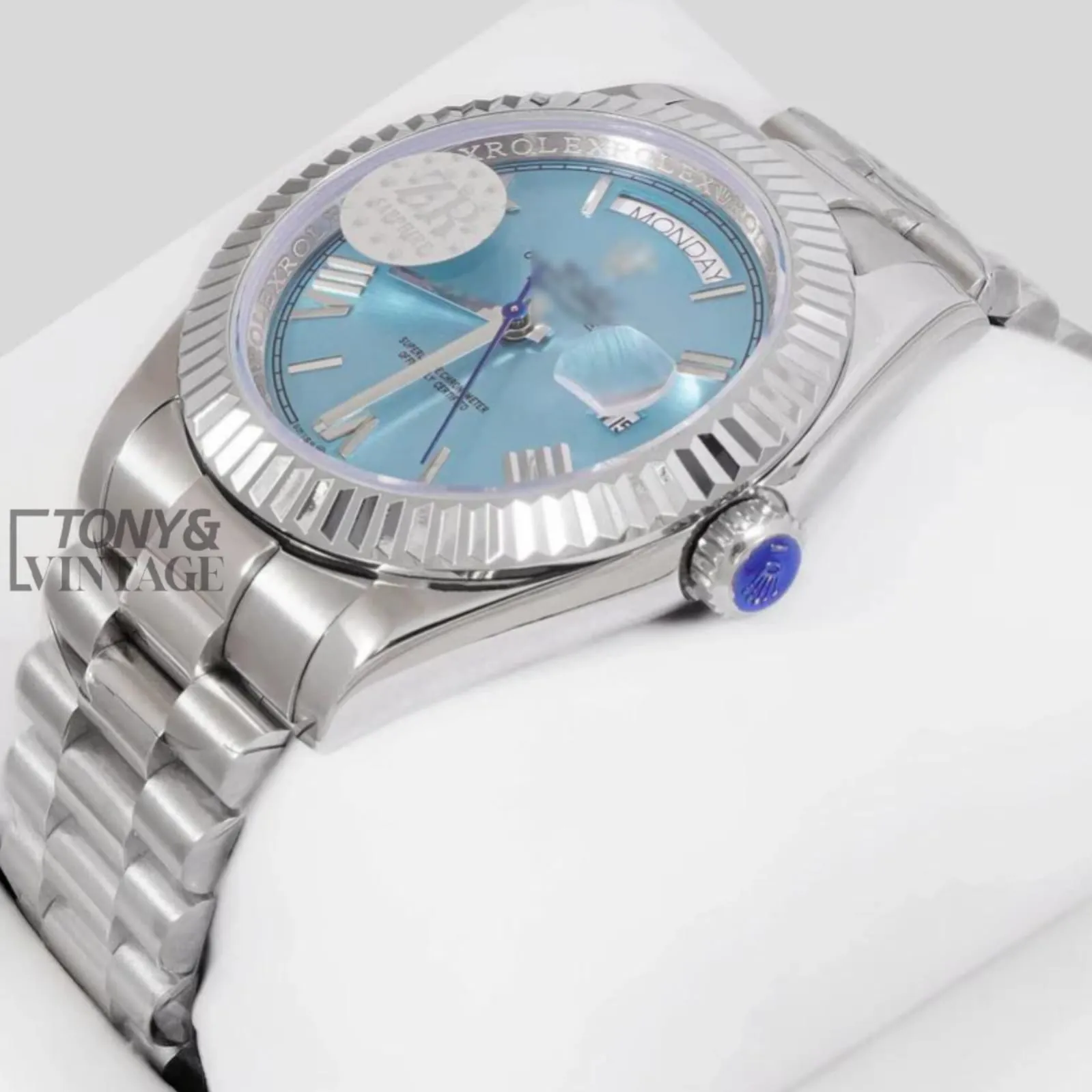 Silver-Chain-Automatic-Watch-with-Blue-Dial-and-Fluted-Bezel1.webp